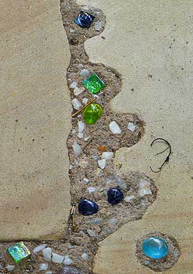a details of the glass and gemstone inserts in the concrete