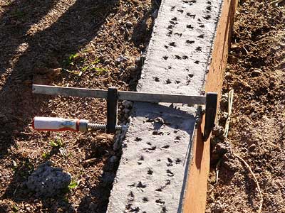 the finished pour complete with dents to key in the mortar for the edge stip of sandstone.